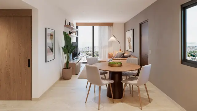 Comedor de un departamento con acceso a estancia y ventana lateral